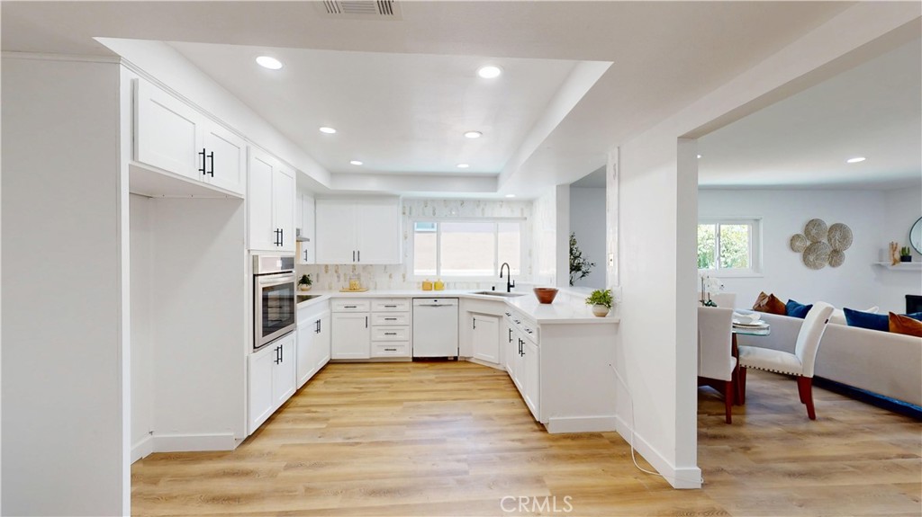 1354 Shadow Fullerton, CA 92831 - Photo 14 of 30 a kitchen with stainless steel appliances kitchen island granite countertop a refrigerator and a stove top oven