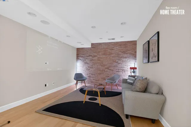 a living room with furniture and a rug