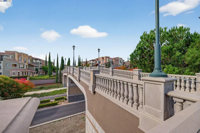 a view of a balcony with chairs