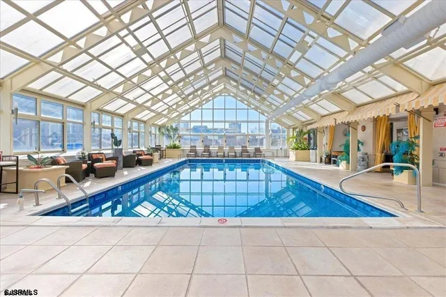 a view of swimming pool with outdoor seating