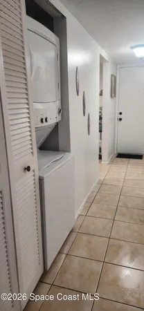 a view of a swimming pool with a patio and a yard