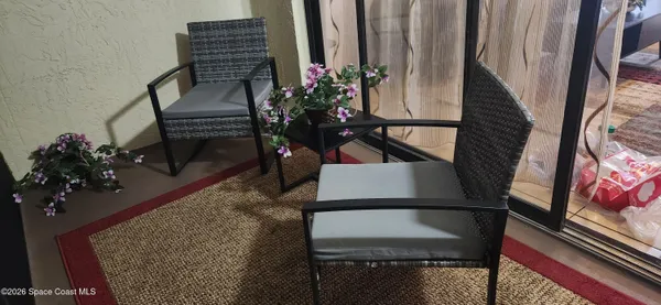 a view of a swimming pool with an outdoor seating and a garden