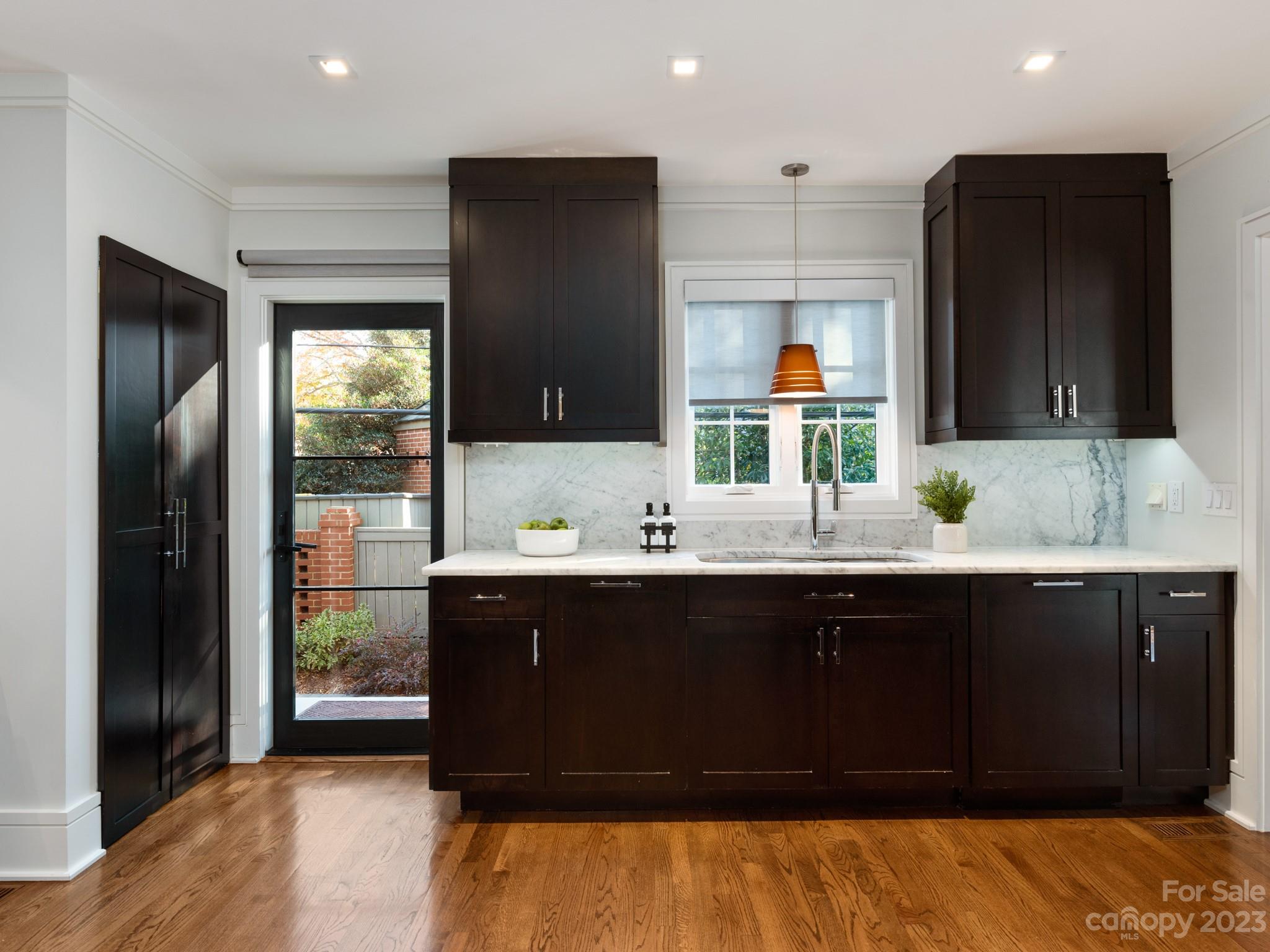 2743 Normandy Road Charlotte, NC 28209 - Photo 16 of 43 a bathroom with a sink and a mirror