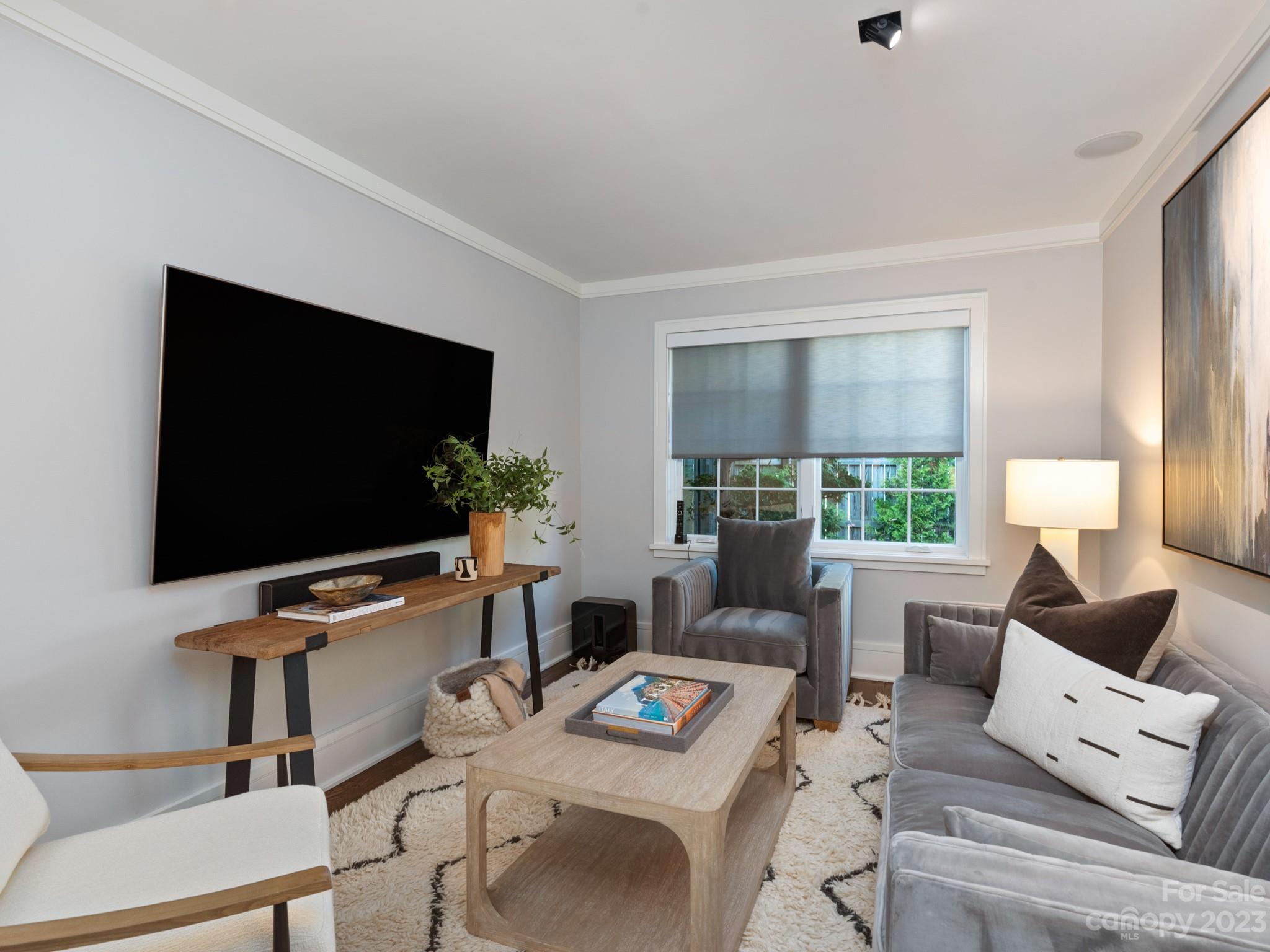 2743 Normandy Road Charlotte, NC 28209 - Photo 18 of 43 a living room with furniture and a flat screen tv