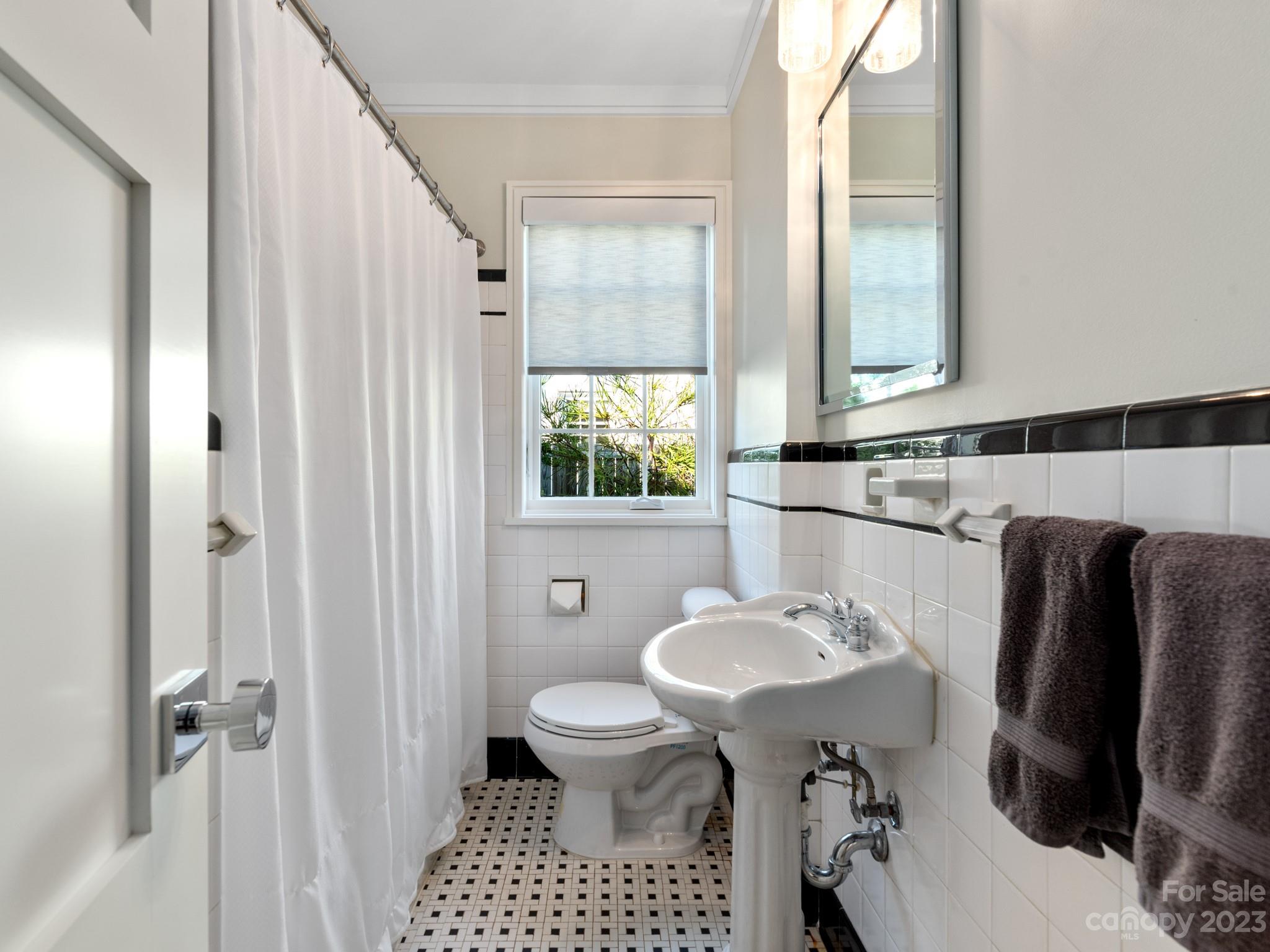 2743 Normandy Road Charlotte, NC 28209 - Photo 20 of 43 a bathroom with a sink and a mirror