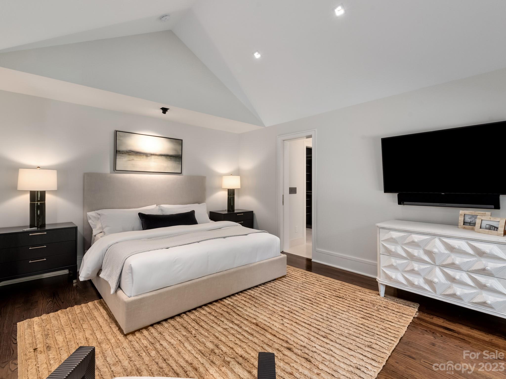 2743 Normandy Road Charlotte, NC 28209 - Photo 23 of 43 a bedroom with a bed and a flat screen tv