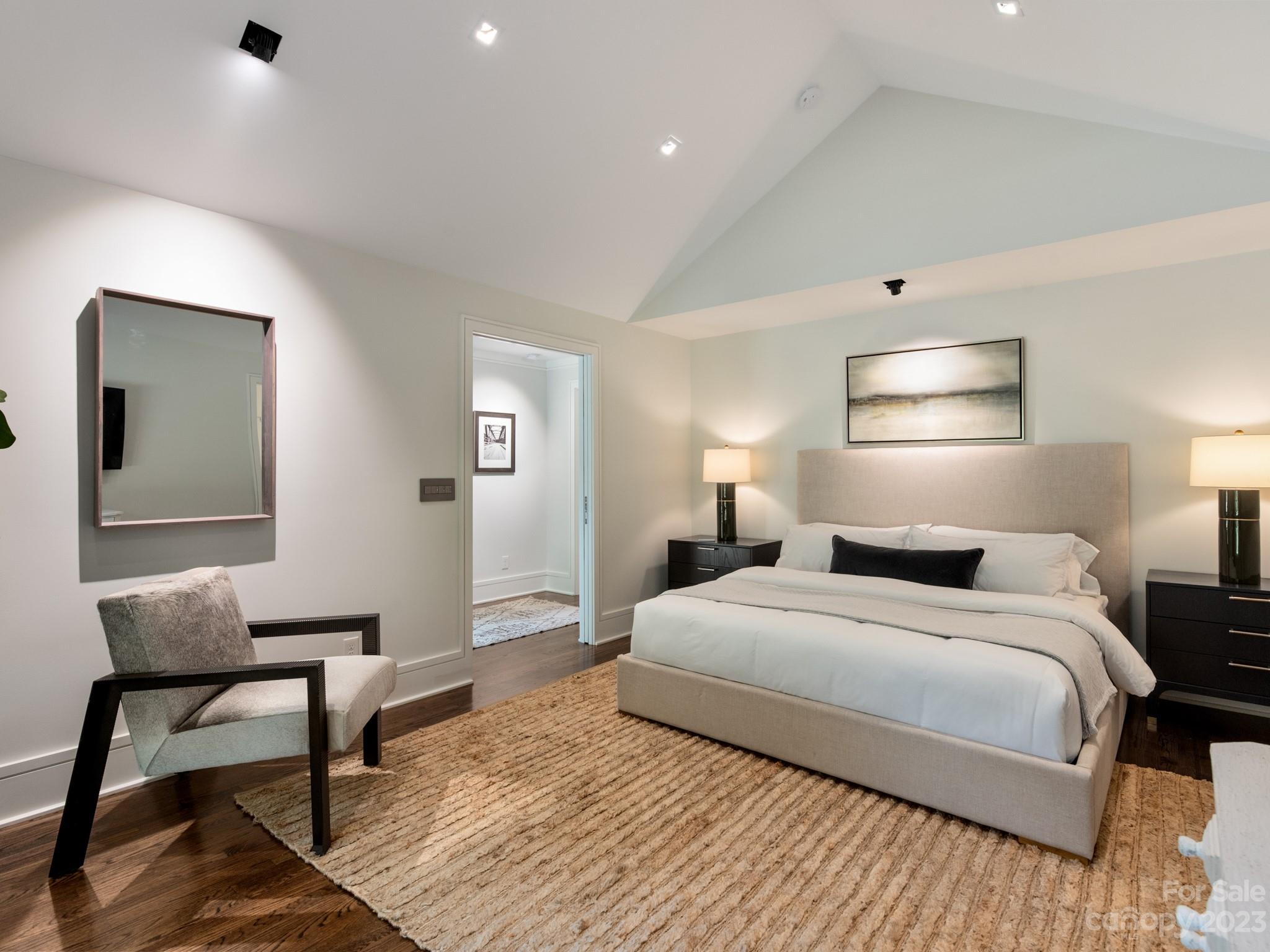 2743 Normandy Road Charlotte, NC 28209 - Photo 24 of 43 a bedroom with a bed and a lamp