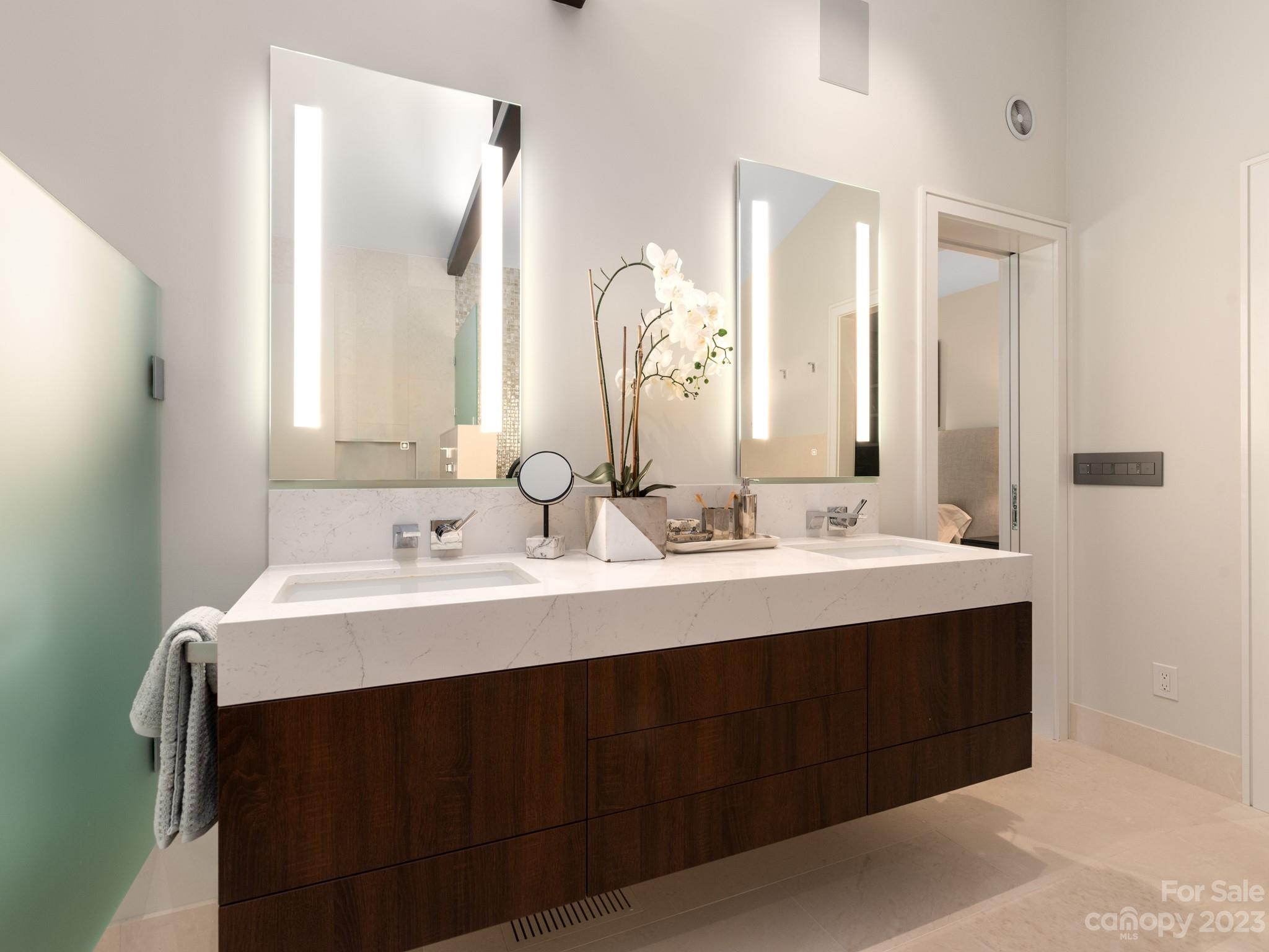 2743 Normandy Road Charlotte, NC 28209 - Photo 27 of 43 a bathroom with a double vanity sink and mirror