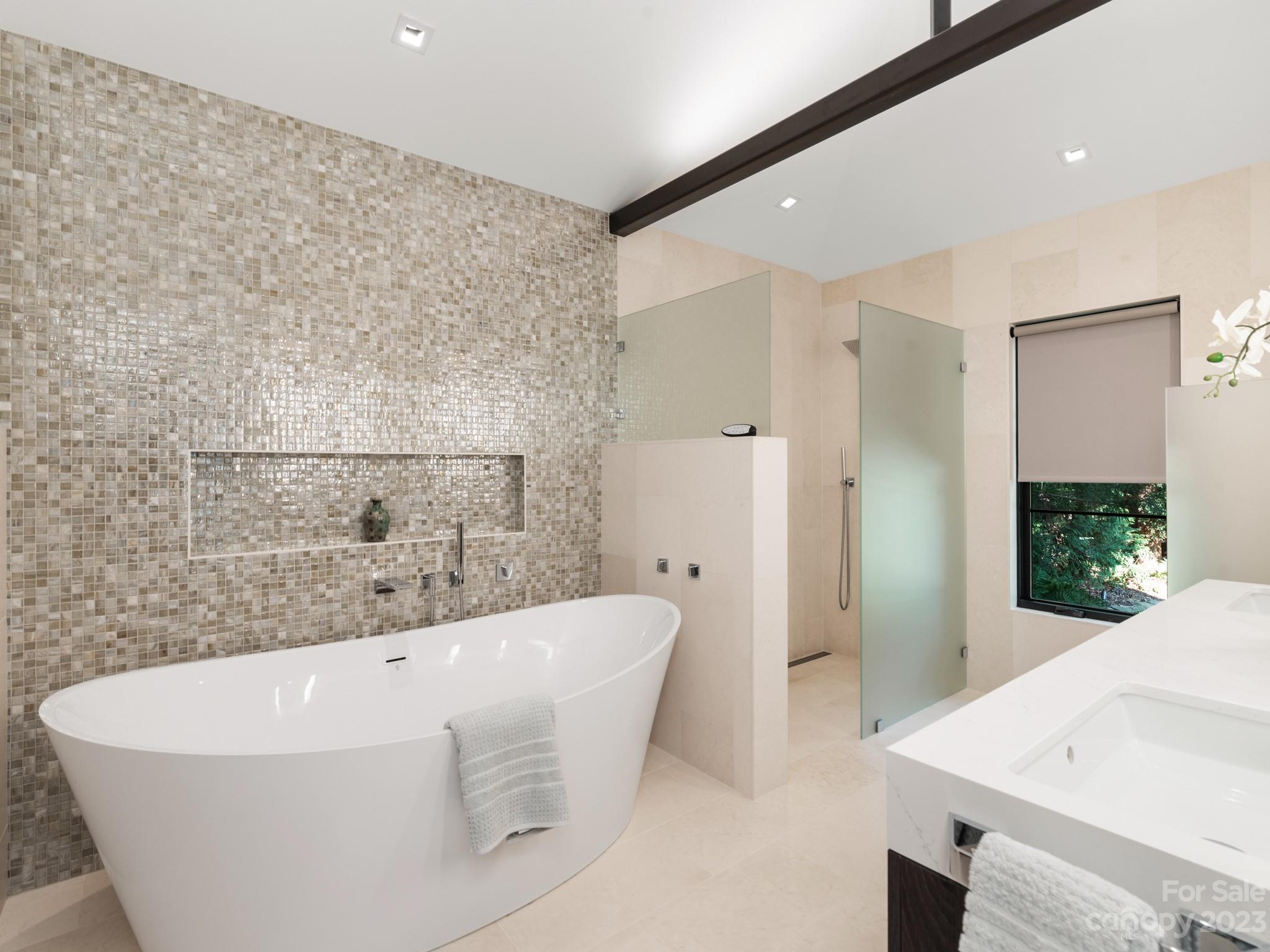 2743 Normandy Road Charlotte, NC 28209 - Photo 29 of 43 a white bath tub sitting in a bathroom