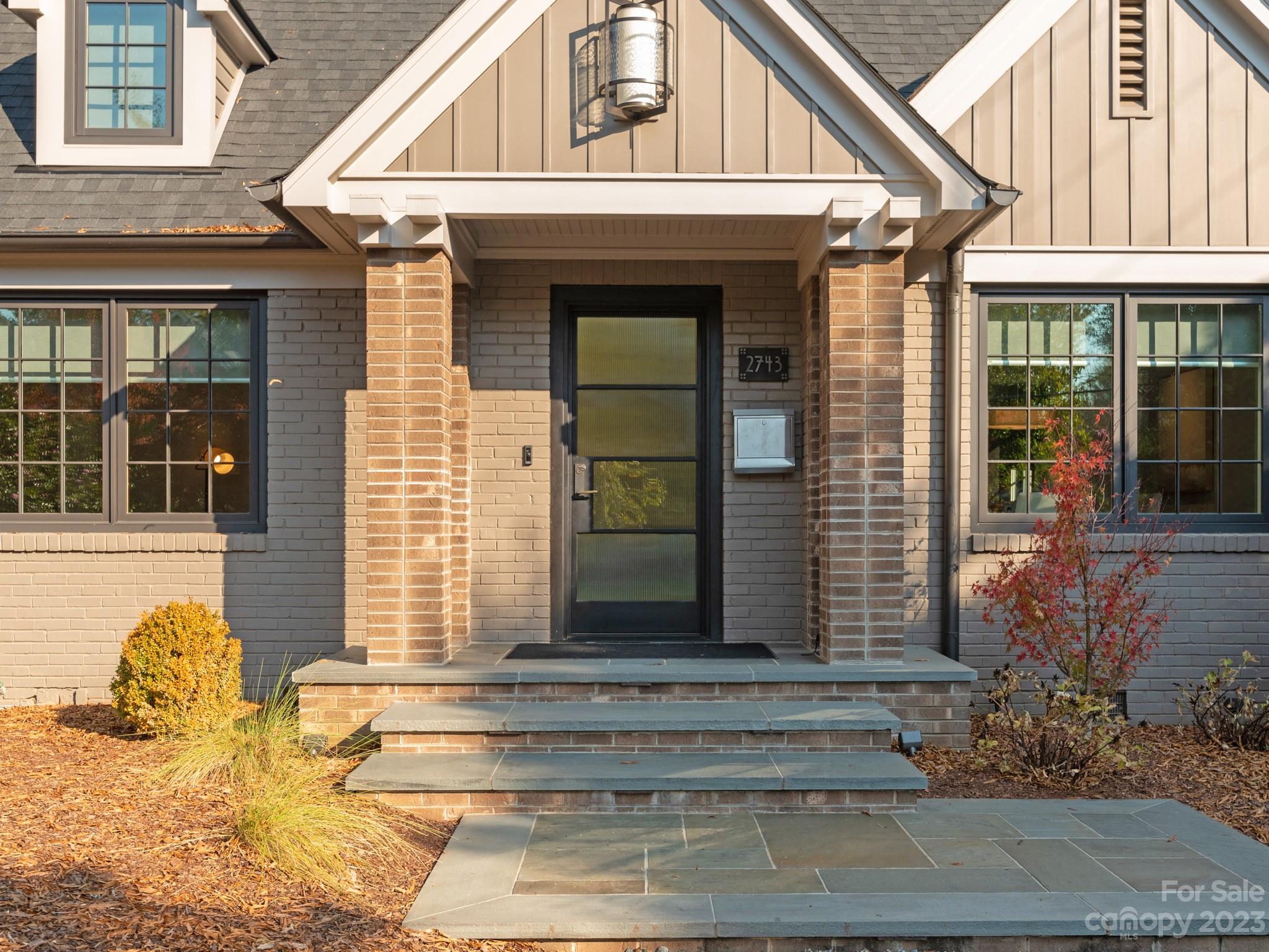 2743 Normandy Road Charlotte, NC 28209 - Photo 3 of 43 a front view of a house with a yard