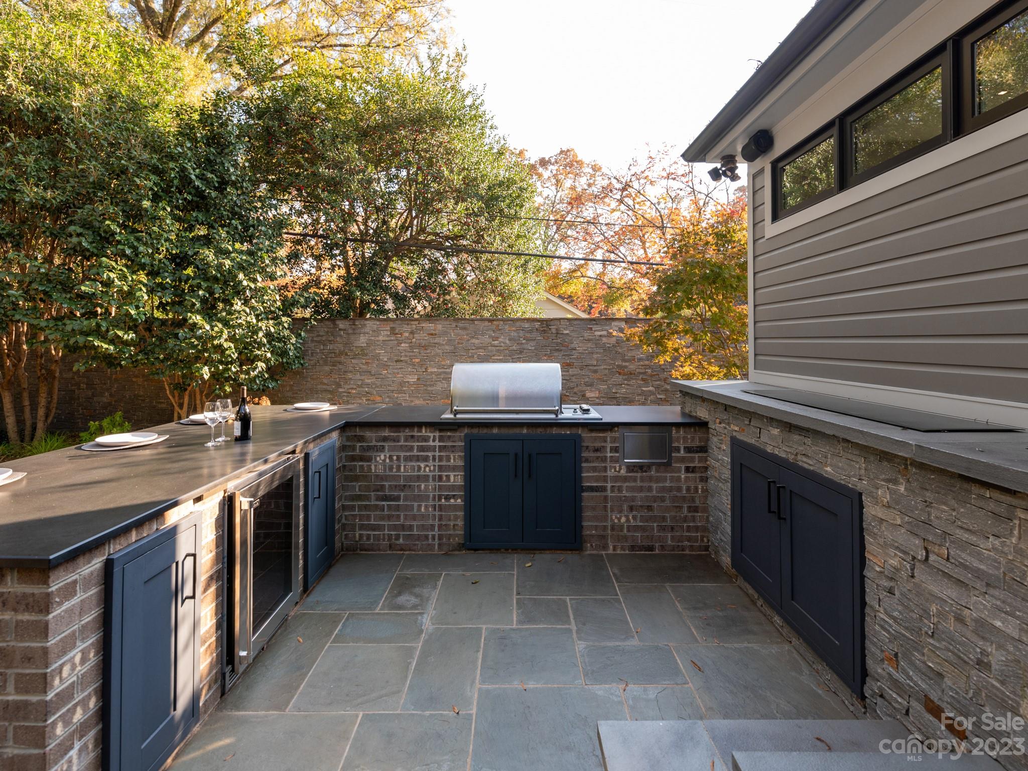 2743 Normandy Road Charlotte, NC 28209 - Photo 34 of 43 a kitchen with stainless steel appliances granite countertop a stove and a sink