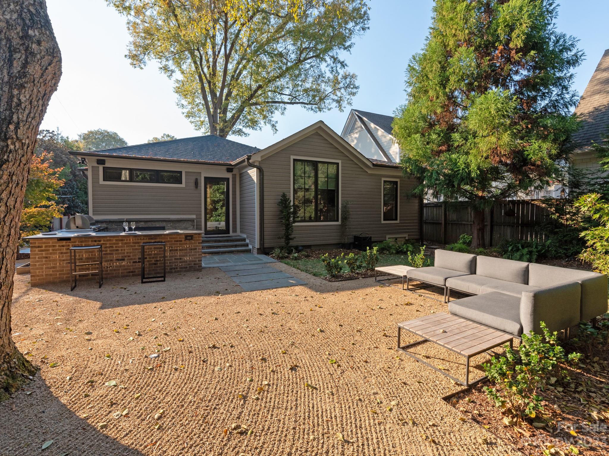 2743 Normandy Road Charlotte, NC 28209 - Photo 38 of 43 a view of a house with backyard and sitting area