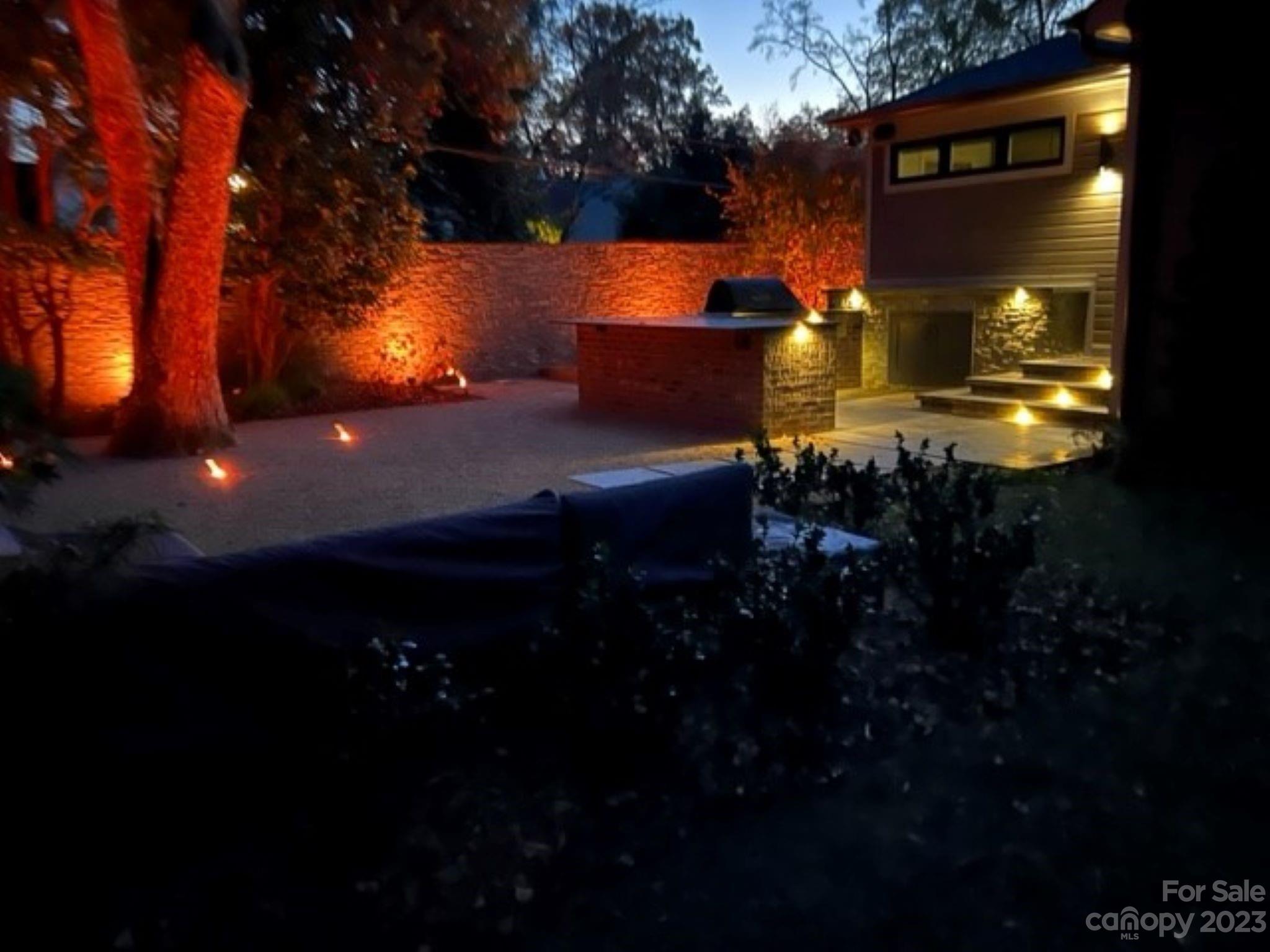 2743 Normandy Road Charlotte, NC 28209 - Photo 40 of 43 a view of a house that has a yard fire pit and wooden fence