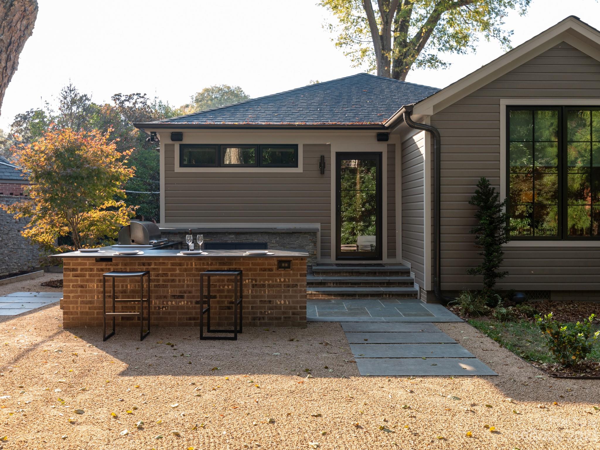 2743 Normandy Road Charlotte, NC 28209 - Photo 41 of 43 a view of house with backyard and sitting area
