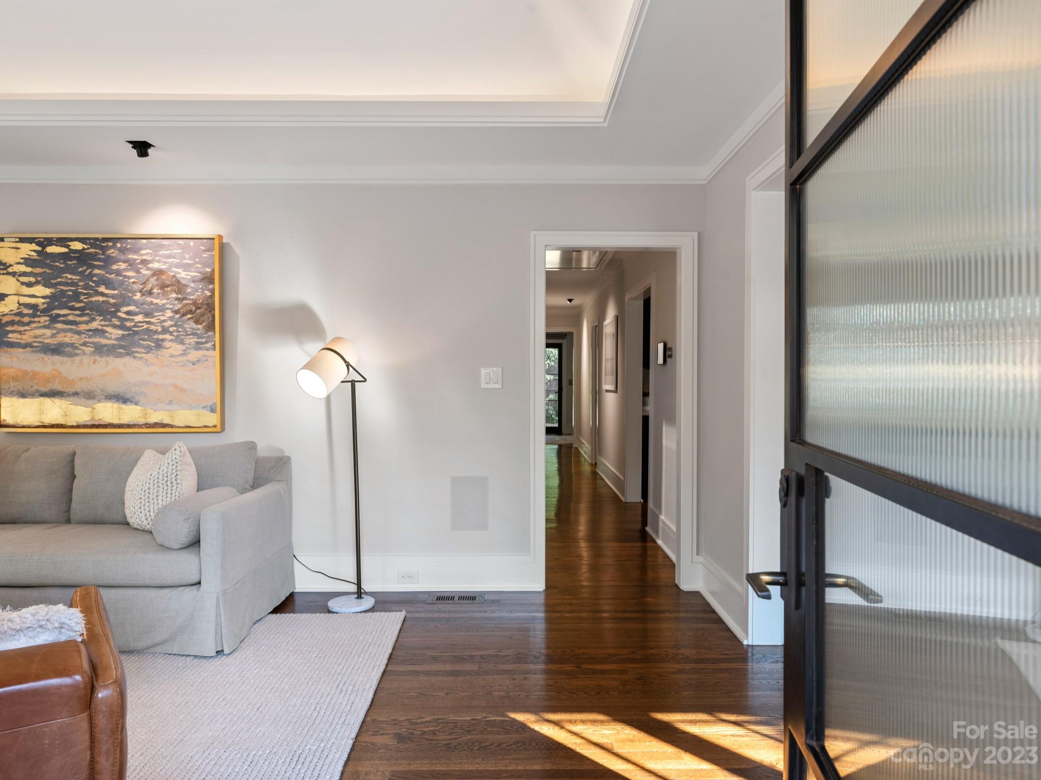 2743 Normandy Road Charlotte, NC 28209 - Photo 5 of 43 a living room with furniture and a floor to ceiling window