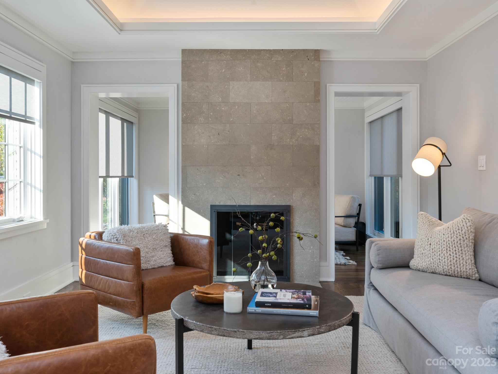 2743 Normandy Road Charlotte, NC 28209 - Photo 7 of 43 a living room with furniture and a fireplace