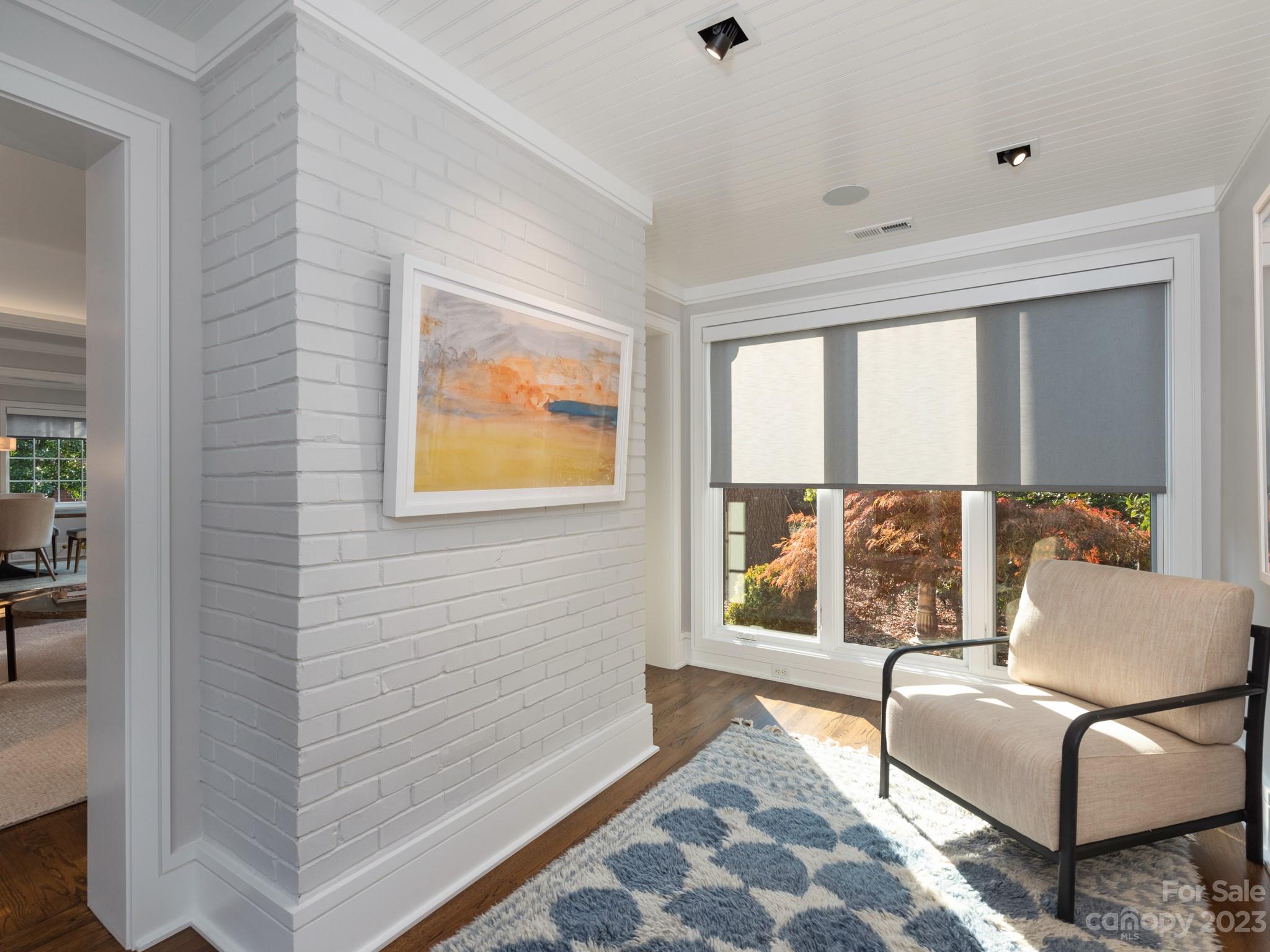 2743 Normandy Road Charlotte, NC 28209 - Photo 10 of 43 a living room with a couch and a window