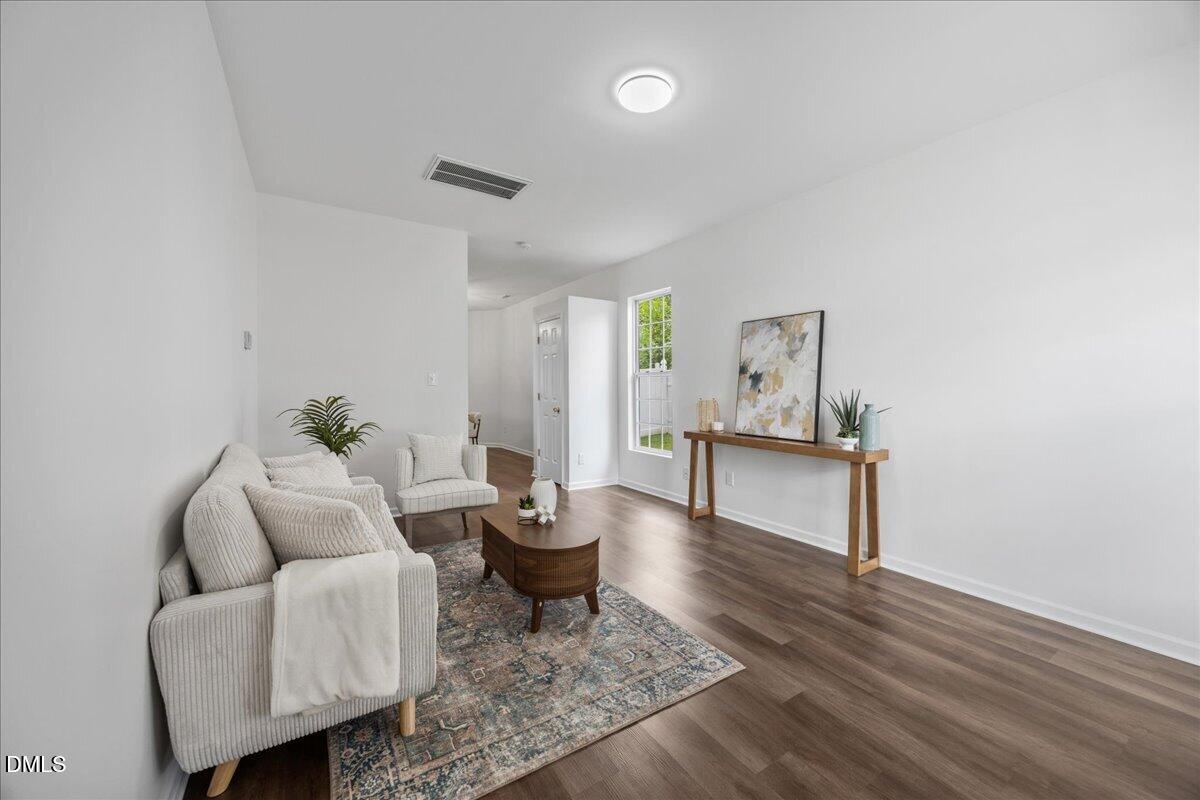 3831 Pin Oak Road Raleigh, NC 27604 - Photo 2 of 24 a living room with furniture and a wooden floor