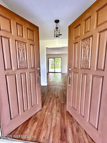 a view of entryway with wooden floor