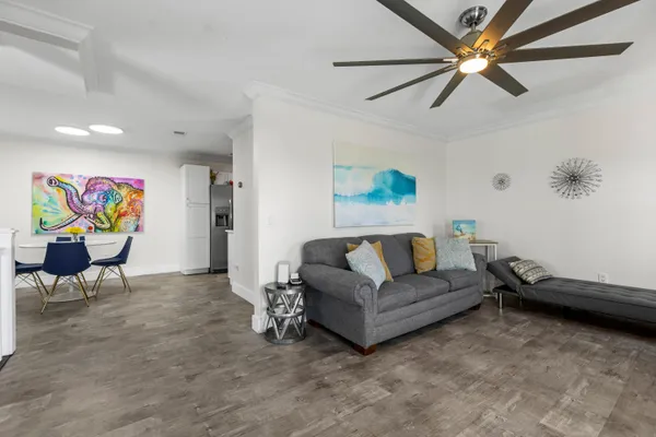 a living room with furniture and a rug