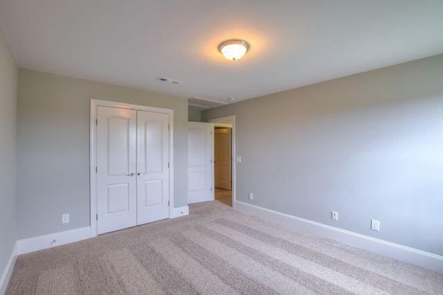 a view of gallery with wooden floor