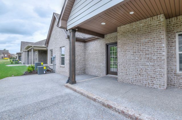 a bathroom with a granite countertop sink mirror toilet and bathtub