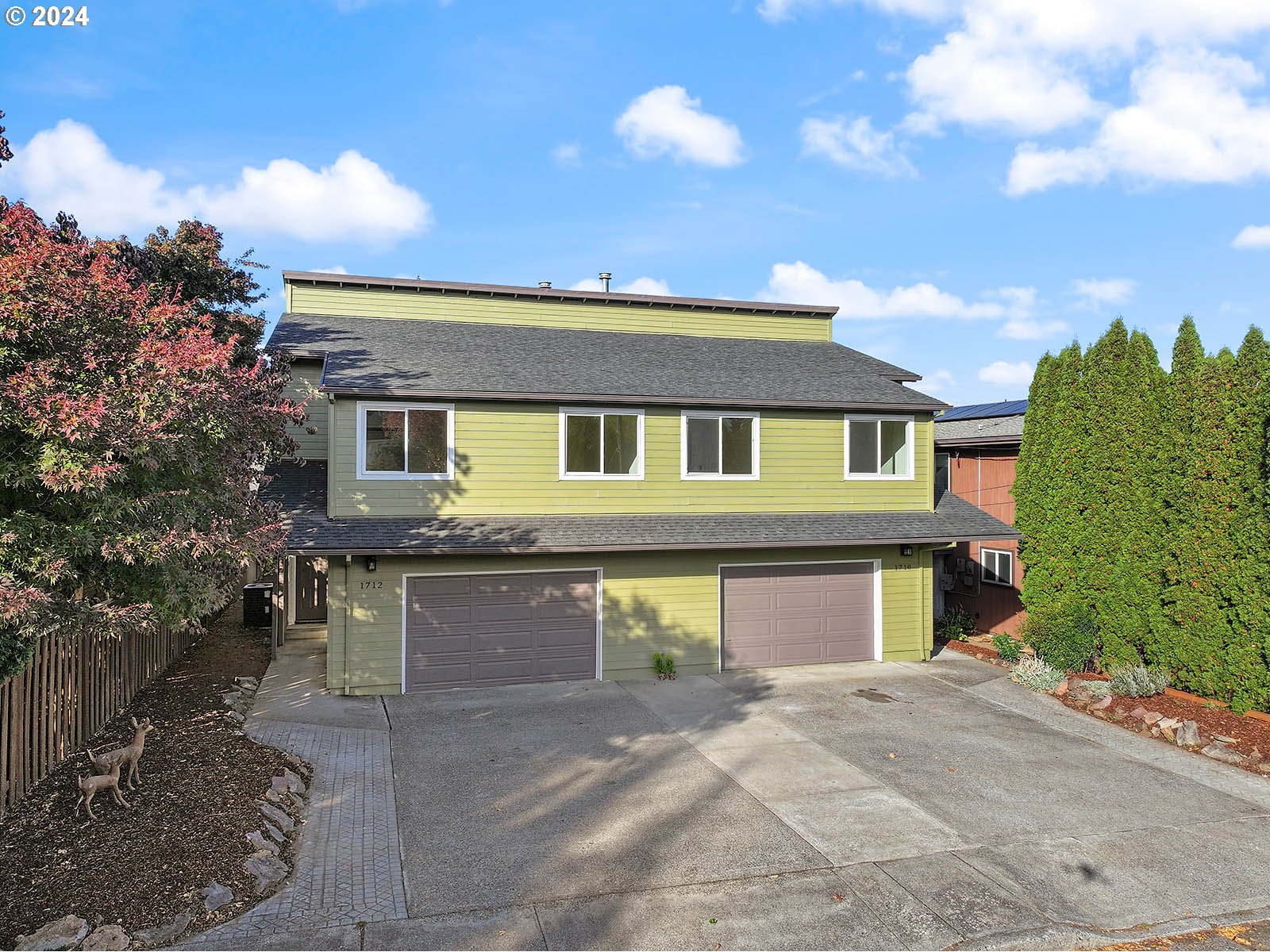 1710 B Street Hood River, OR 97031 - Photo 1 of 42 a front view of a house with a yard and garage