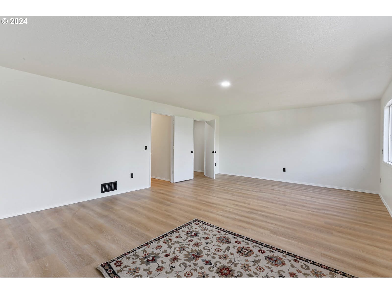 1710 B Street Hood River, OR 97031 - Photo 16 of 42 a view of an empty room with wooden floor