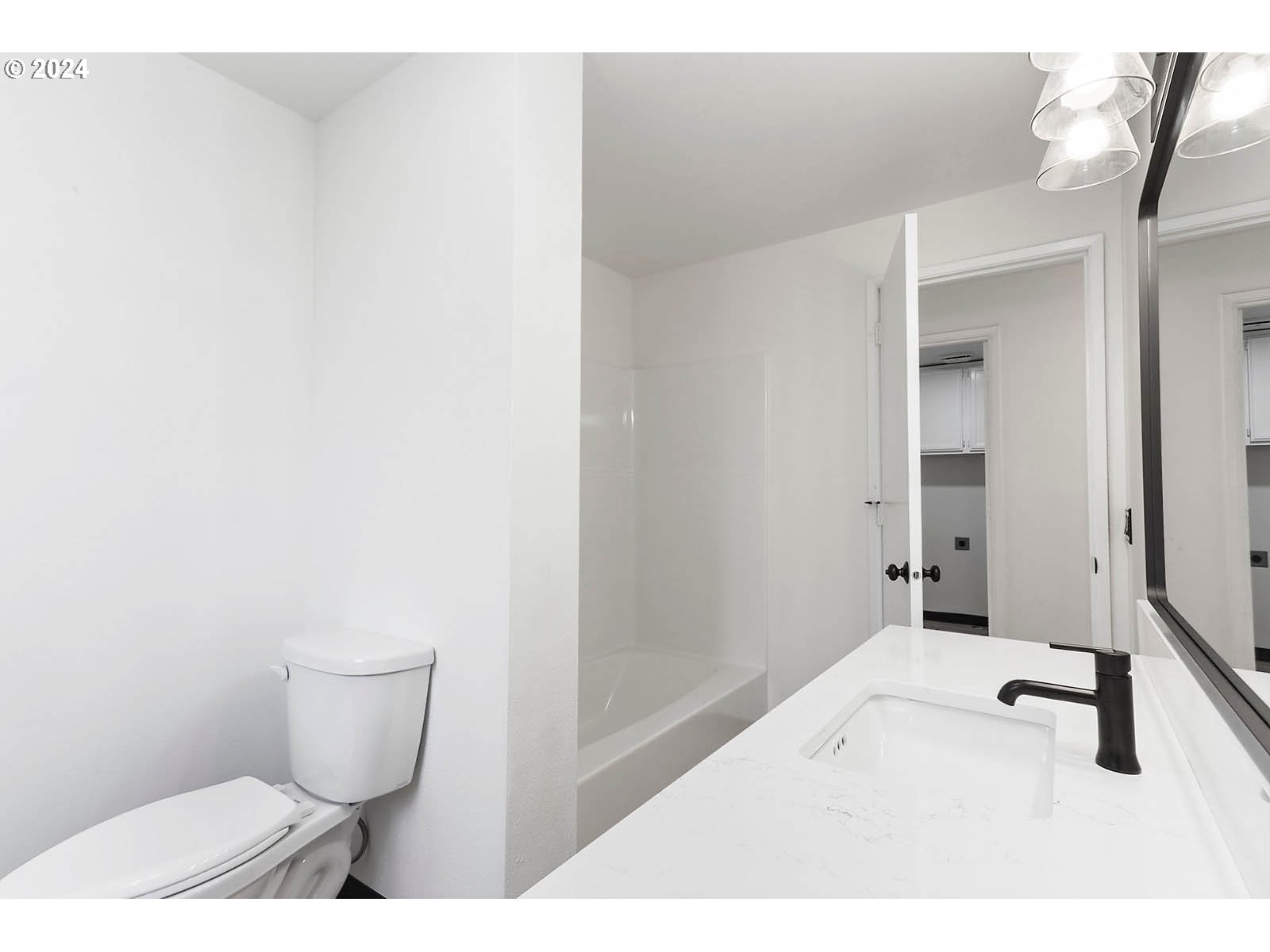 1710 B Street Hood River, OR 97031 - Photo 18 of 42 a bathroom with a toilet and a vanity