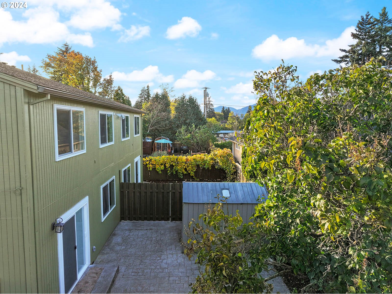 1710 B Street Hood River, OR 97031 - Photo 3 of 42 a view of a house with wooden fence