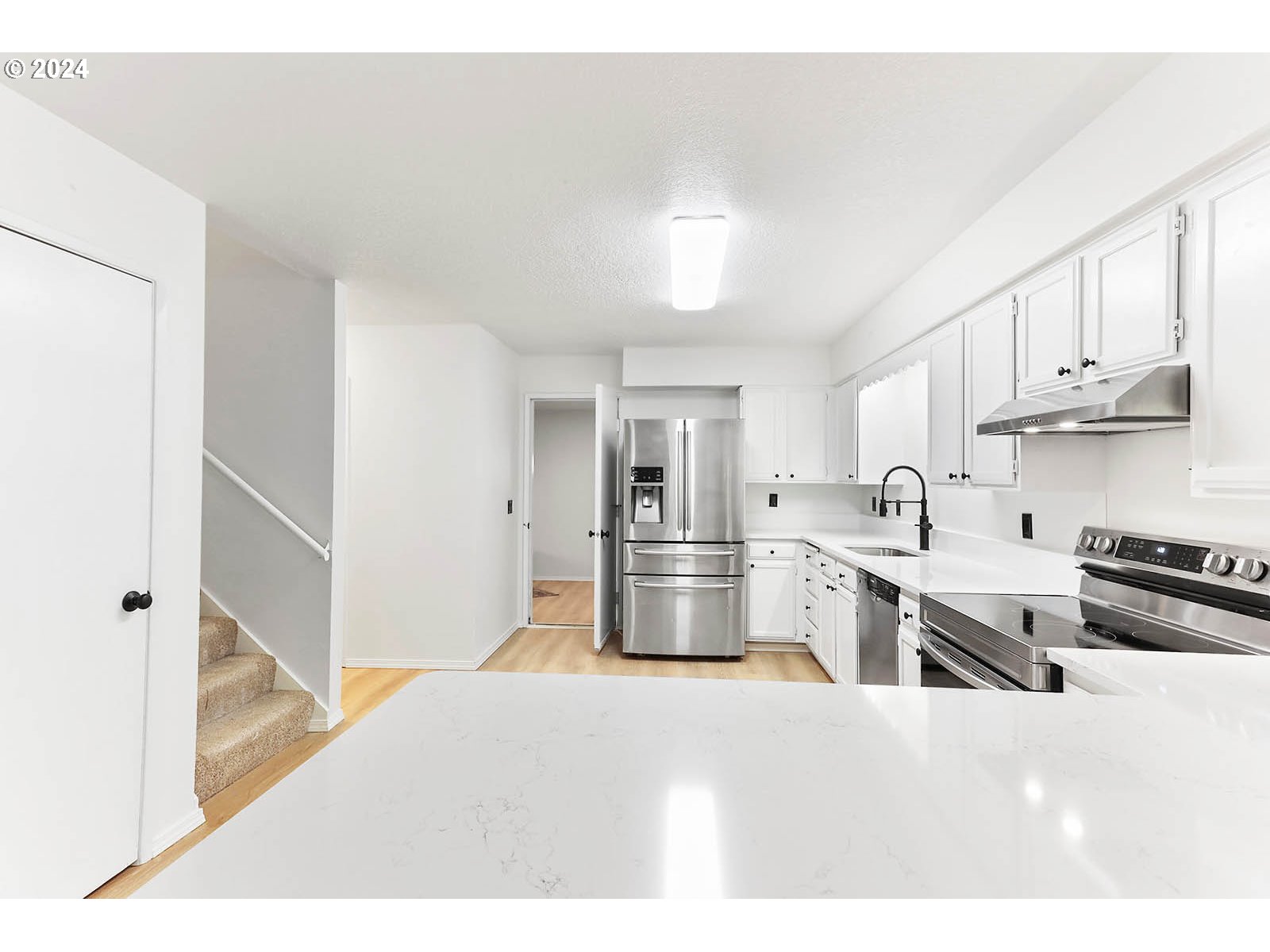 1710 B Street Hood River, OR 97031 - Photo 9 of 42 a kitchen with stainless steel appliances granite countertop a stove refrigerator and cabinets