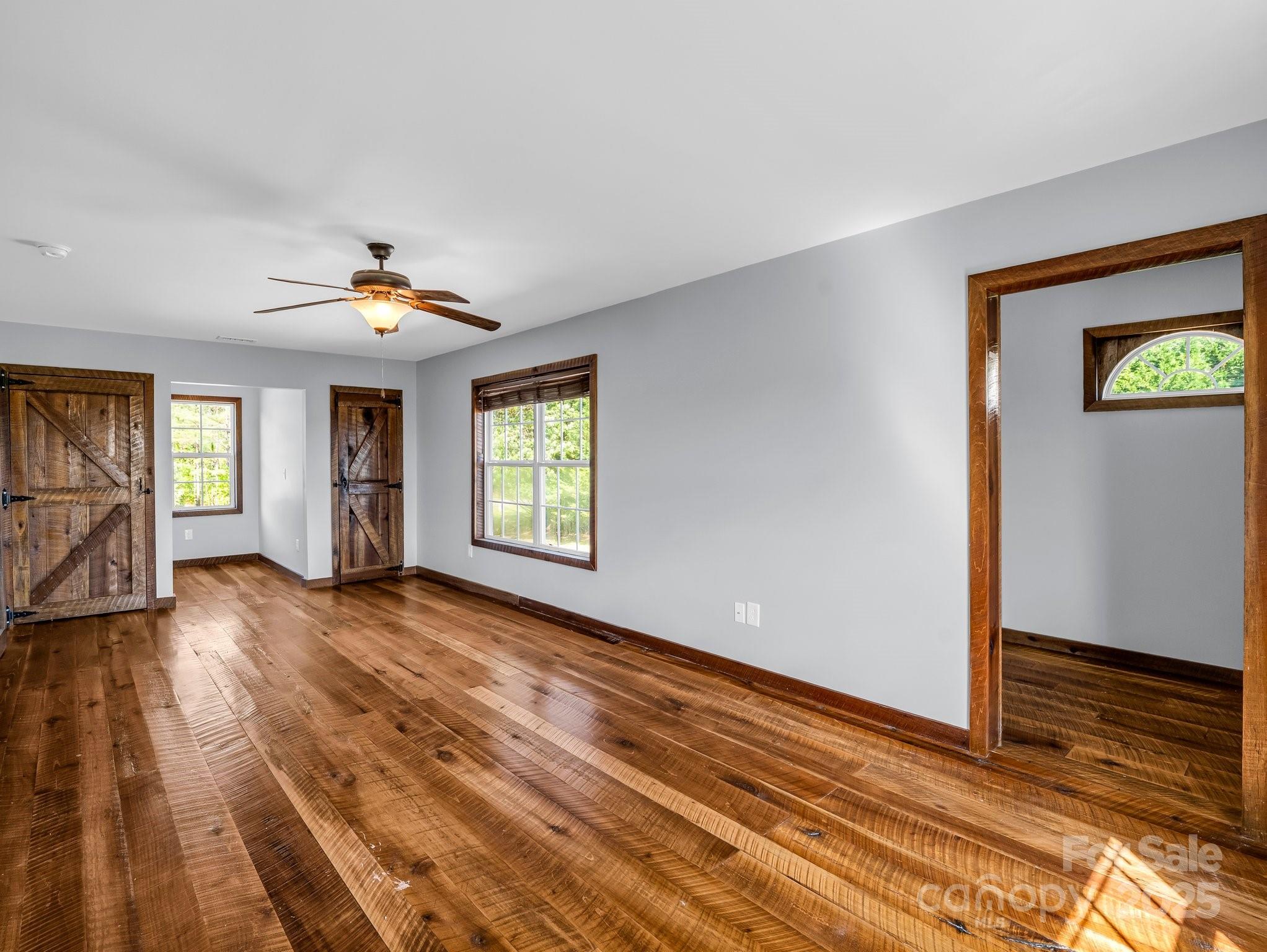 4830 Chesnee Road Rutherfordton, NC 28139 - Photo 40 of 45 a view of an empty room with window and wooden floor