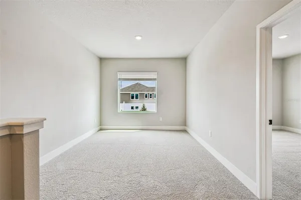 a view of a livingroom with a kitchen