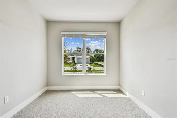 an empty room with a bathroom