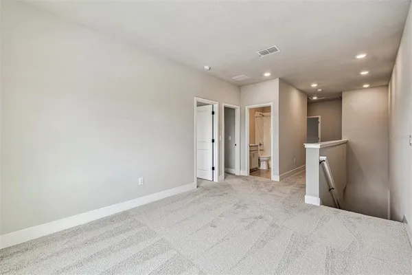 a bedroom with a bed and a couch