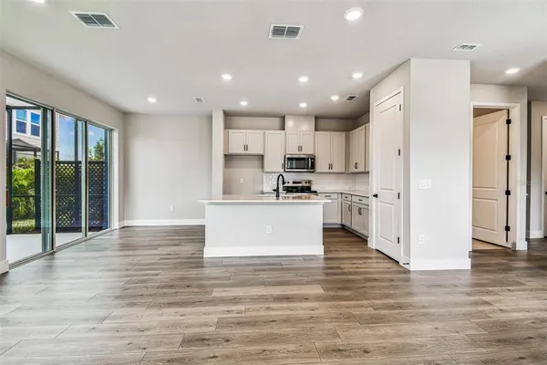 a kitchen with stainless steel appliances granite countertop a stove and a sink