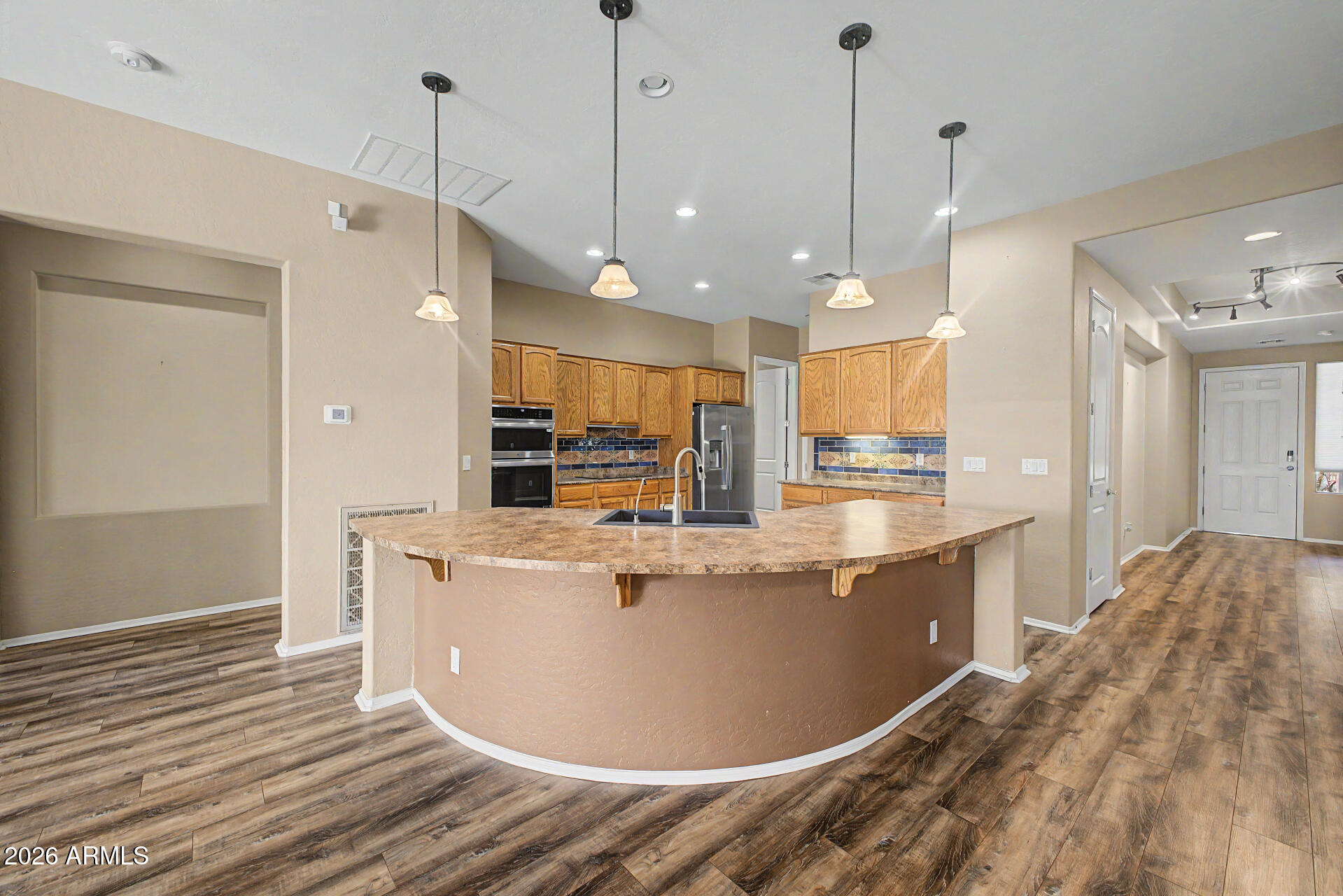 5090 South Ranger Trail Gilbert, AZ 85298 - Photo 9 of 50 a view of kitchen with stainless steel appliances granite countertop sink stove and refrigerator
