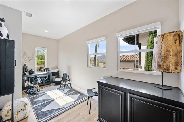 a living room with furniture and large window