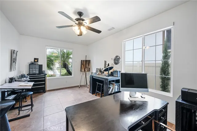 a workspace with furniture and window