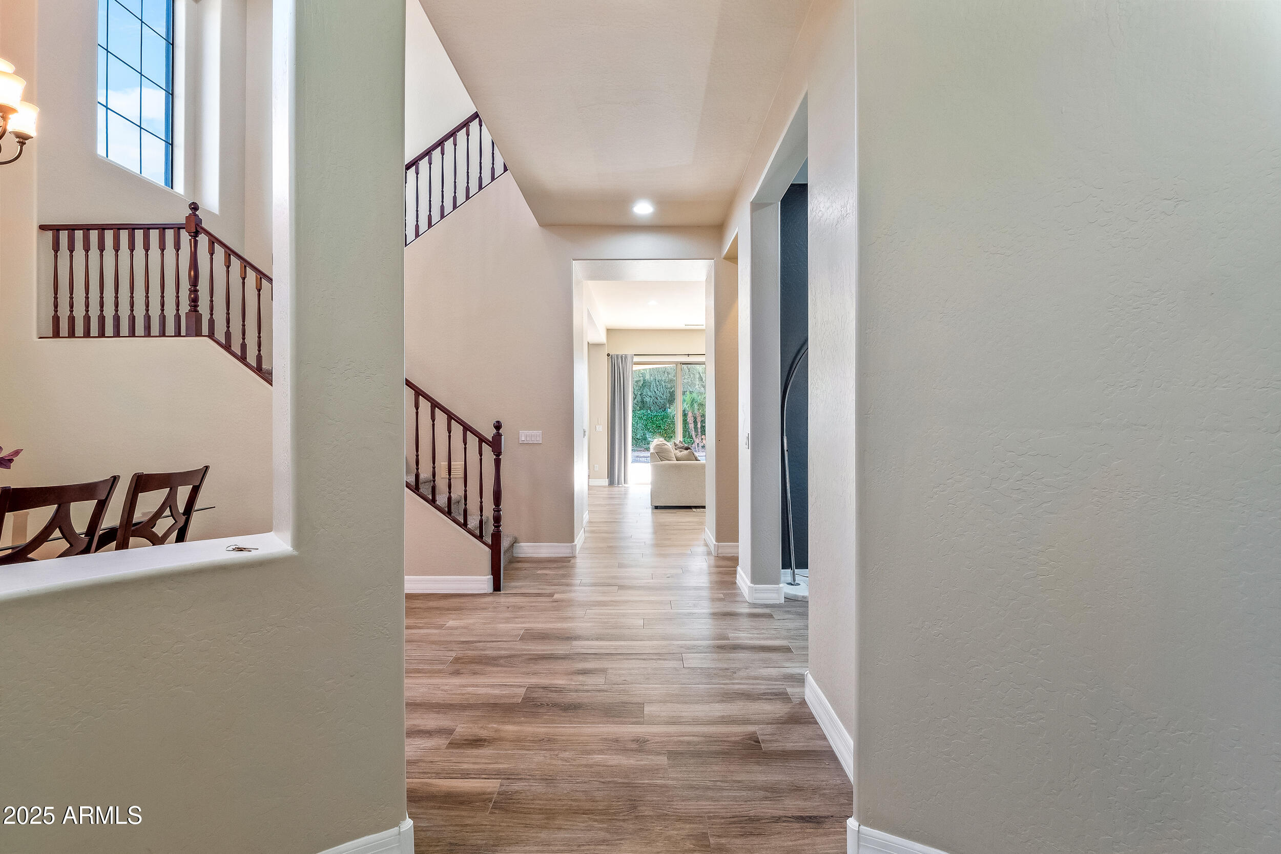 2955 East Blue Sage Road Gilbert, AZ 85297 - Photo 12 of 55 a view of a hallway with wooden floor and staircase