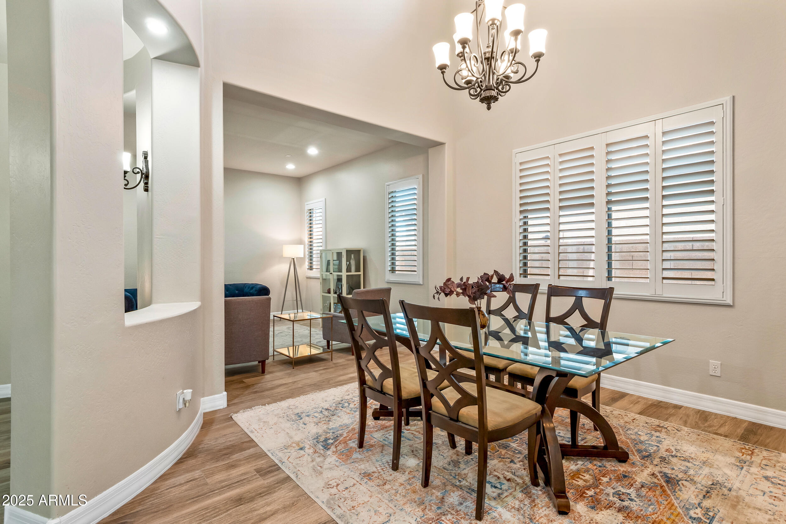 2955 East Blue Sage Road Gilbert, AZ 85297 - Photo 14 of 55 a view of a dining room with furniture and chandelier