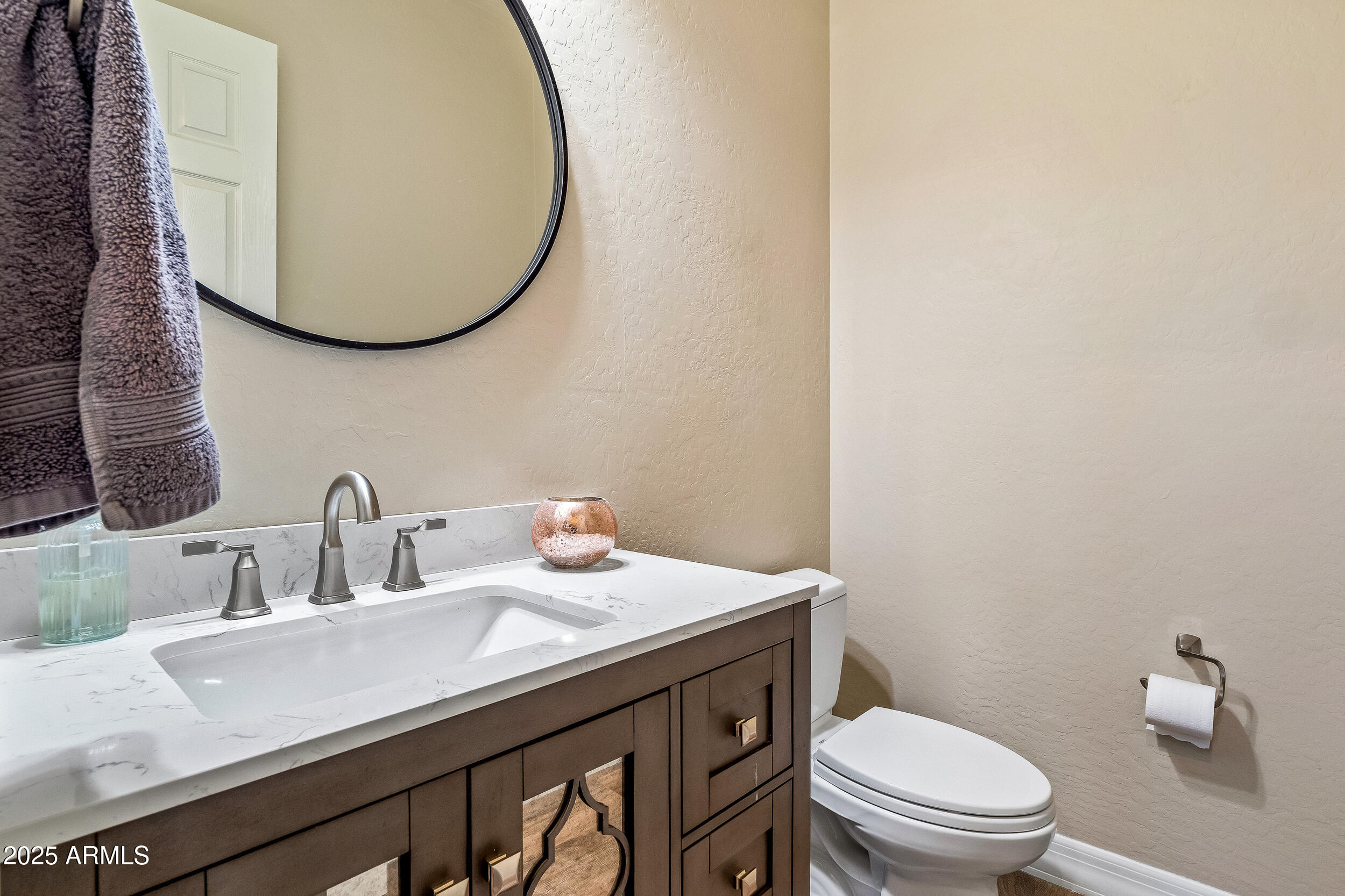 2955 East Blue Sage Road Gilbert, AZ 85297 - Photo 17 of 55 a bathroom with a granite countertop toilet sink and mirror