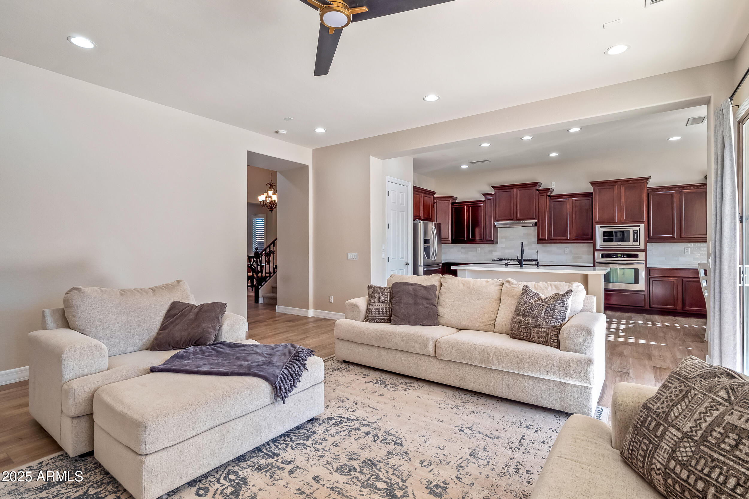 2955 East Blue Sage Road Gilbert, AZ 85297 - Photo 19 of 55 a living room with furniture and kitchen view