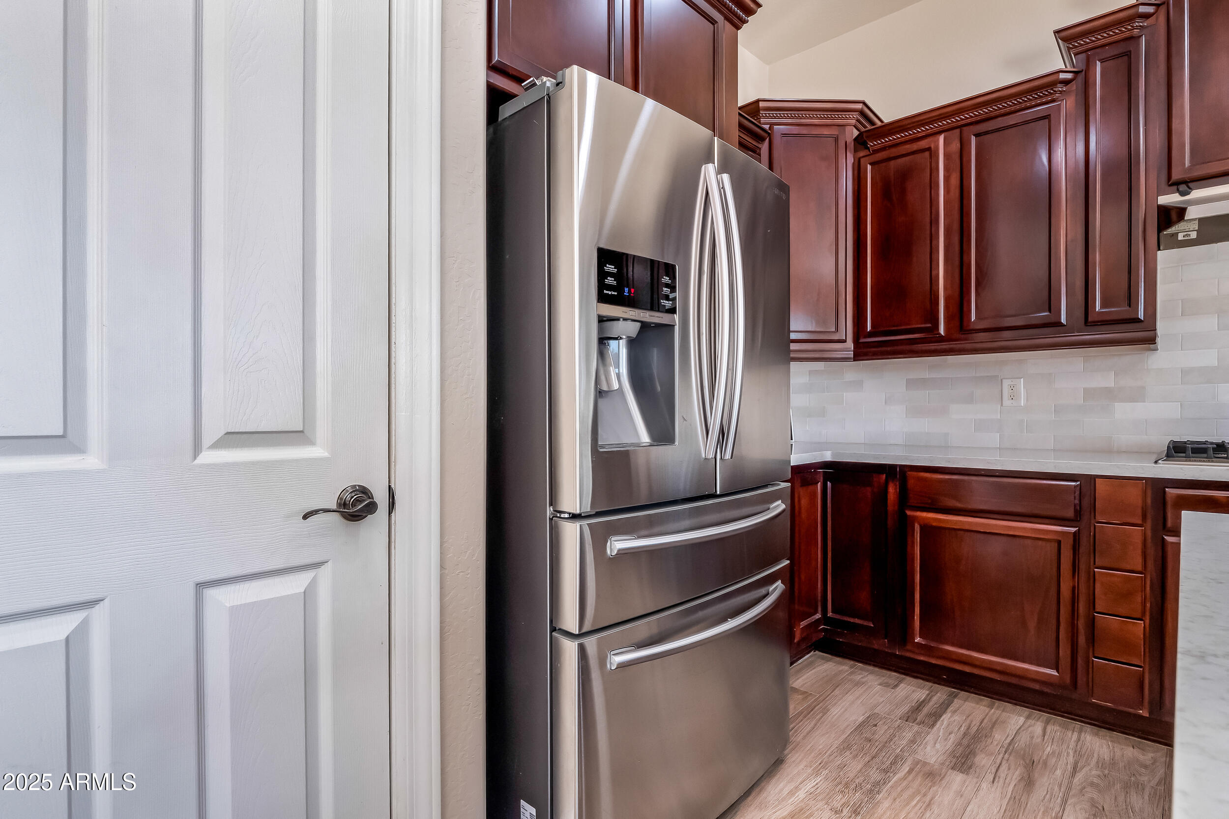 2955 East Blue Sage Road Gilbert, AZ 85297 - Photo 24 of 55 a metallic refrigerator freezer sitting in a kitchen