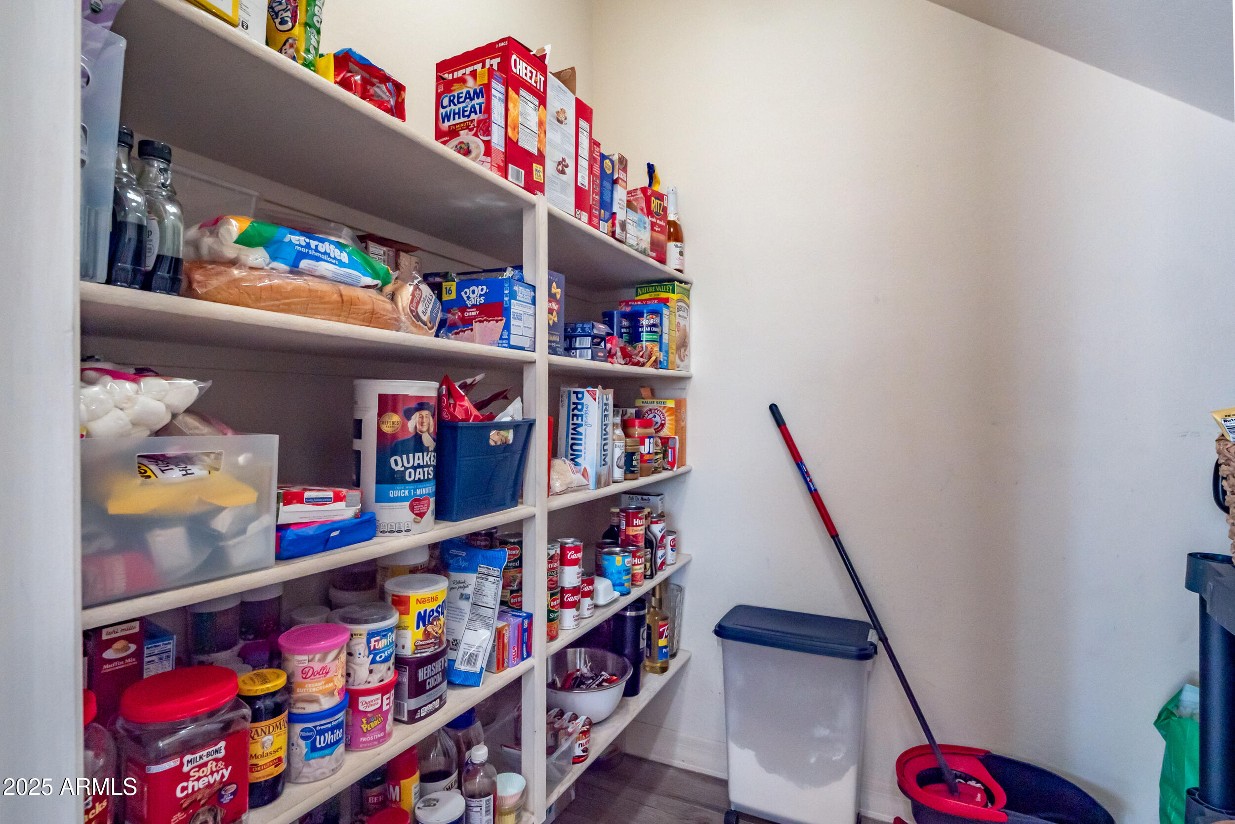 2955 East Blue Sage Road Gilbert, AZ 85297 - Photo 25 of 55 a room with lots of books