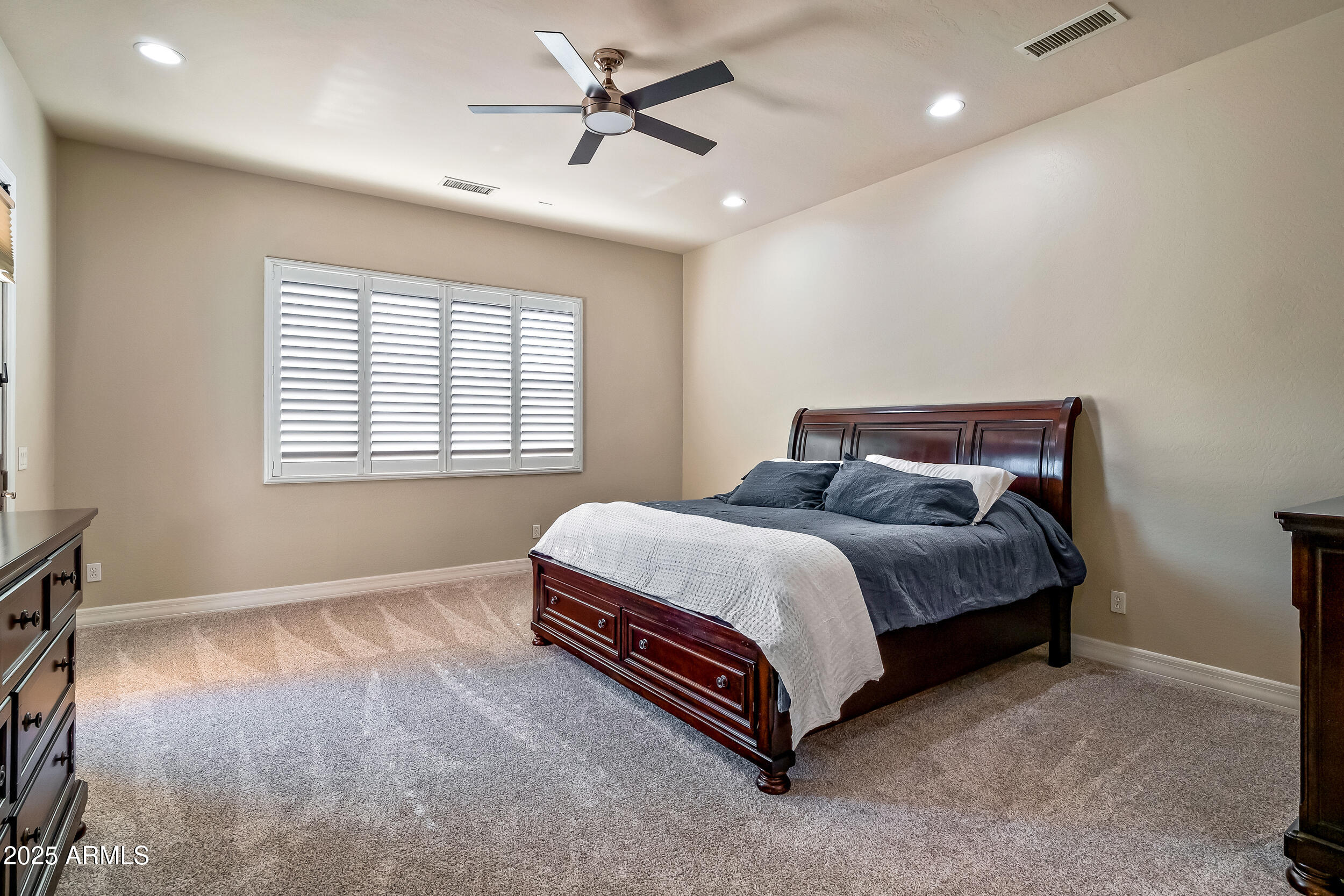 2955 East Blue Sage Road Gilbert, AZ 85297 - Photo 27 of 55 a spacious bedroom with a bed and a window