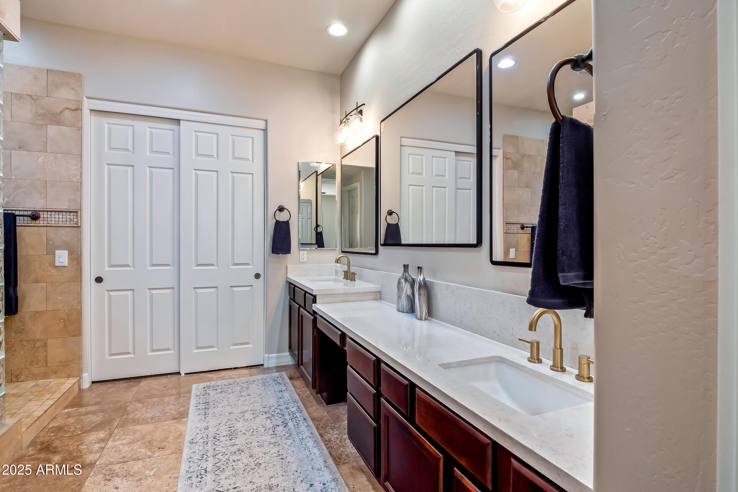 2955 East Blue Sage Road Gilbert, AZ 85297 - Photo 29 of 55 a bathroom with a sink vanity and a mirror