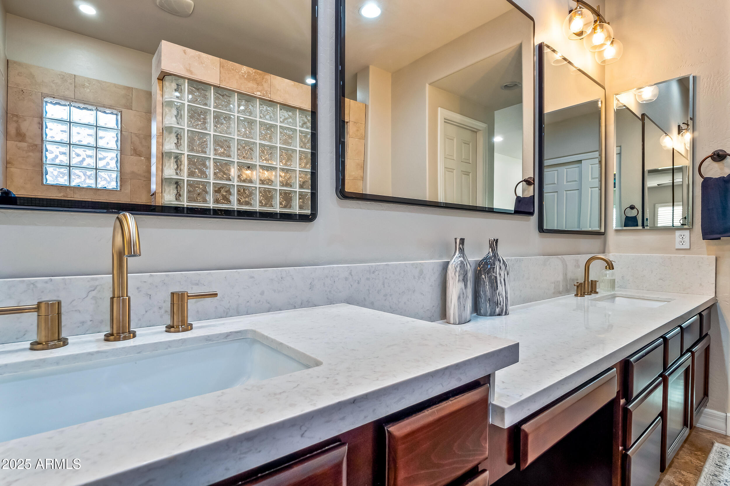2955 East Blue Sage Road Gilbert, AZ 85297 - Photo 31 of 55 a bathroom with a sink and a mirror