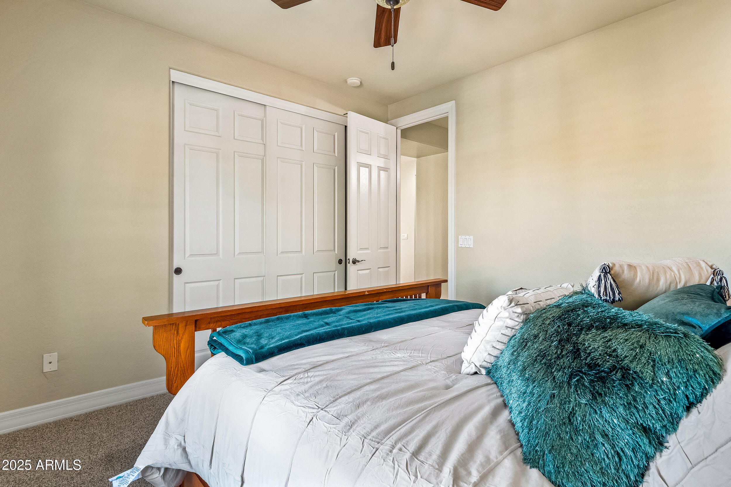 2955 East Blue Sage Road Gilbert, AZ 85297 - Photo 40 of 55 a blue bed sitting in a bedroom next to a window