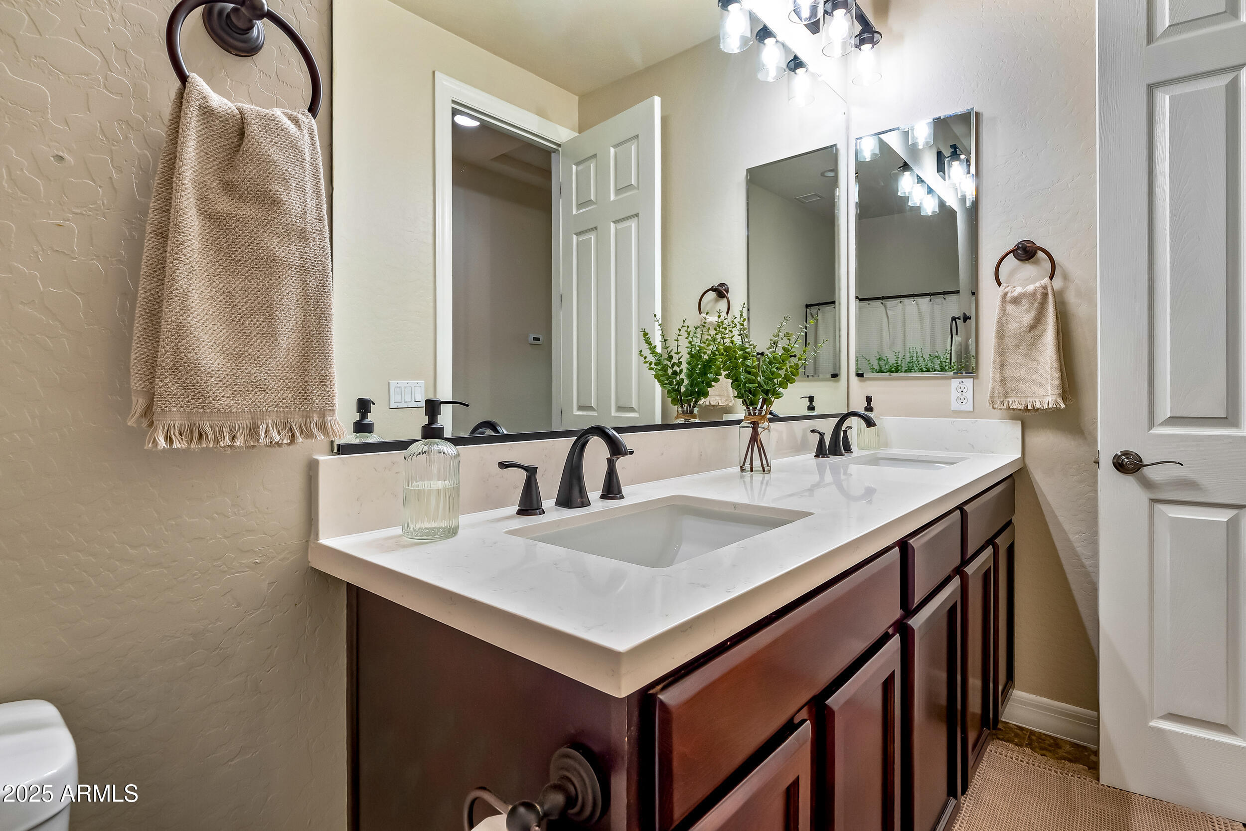 2955 East Blue Sage Road Gilbert, AZ 85297 - Photo 46 of 55 a bathroom with a sink and a mirror
